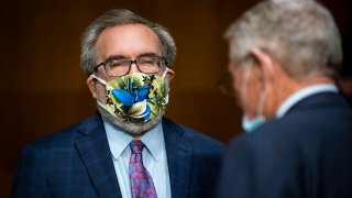 WASHINGTON, DC - MAY 20: Andrew Wheeler, administrator of the Environmental Protection Agency (EPA), wears a face mask as he arrives during a Senate Environment and Public Works Committee hearing, May 20, 2020 on Capitol Hill in Washington, D.C. EPA Administrator Andrew Wheeler will face questions as his agency faces legal challenges and criticism for easing enforcement during the COVID-19 pandemic and rolling back vehicle emissions rules.