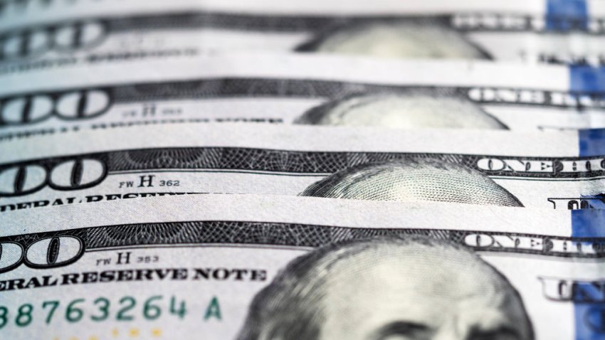 UKRAINE – 2020/07/09: A photo illustration of US 100 dollar bills. (Photo Illustration by Igor Golovniov/SOPA Images/LightRocket via Getty Images)