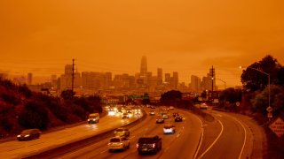 San Francisco highway is seen with orange glow as a result of wildfires