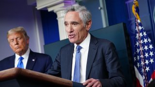 In this Sept. 23, 2020, file photo, President Donald Trump listens to White House coronavirus adviser Dr. Scott Atlas speak during a press conference in the Brady Briefing Room of the White House in Washington, DC.