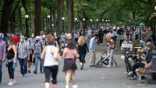 NEW YORK, NEW YORK – SEPTEMBER 26: People with and without masks avoid social distancing while walking in Central Park as the city continues Phase 4 of re-opening following restrictions imposed to slow the spread of coronavirus on September 26, 2020 in New York City. The fourth phase allows outdoor arts and entertainment, sporting events without fans and media production. (Photo by Alexi Rosenfeld/Getty Images)