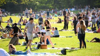 People fill Sheep Meadow in Central Park as the city continues Phase 4 of re-opening following restrictions imposed to slow the spread of coronavirus on Sept. 26, 2020, in New York City.