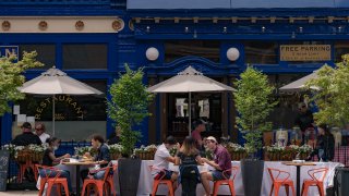 Customers have a lunch outside a restaurant as the city reopens from the coronavirus lockdown on June 15, 2020 in Hoboken, New Jersey.