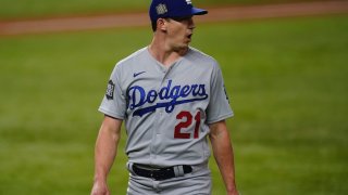 Los Angeles Dodgers starting pitcher Walker Buehler celebrates the end of the third inning against the Tampa Bay Rays in Game 3 of the baseball World Series Friday, Oct. 23, 2020, in Arlington, Texas.