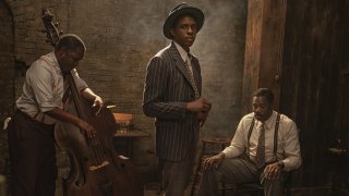 This image released by Netflix shows Michael Potts, from left, Chadwick Boseman and Colman Domingo in "Ma Rainey's Black Bottom." Netflix on Monday previewed George C. Wolfe’s August Wilson adaptation “Ma Rainey’s Black Bottom,” showcasing Chadwick Boseman’s final performance opposite Viola Davis’ powerhouse blues singer.