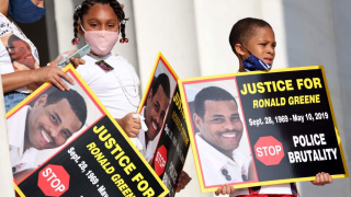 Family members of Ronald Greene listen to speakers during the "Commitment March: Get Your Knee Off Our Necks" protest against racism and police brutality, at the Lincoln Memorial on August 28, 2020, in Washington DC. Greene died in police custody following a high-speed chase in Louisiana in 2019.