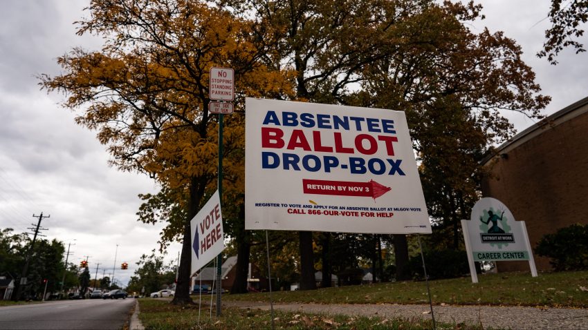 A sign directing voters to the absentee ballot drop-box at one of the Satellite Voting Center inside Northwest Activity Center during early U.S. Presidential Election voting in Detroit, Michigan on Thursday, October 15, 2020.