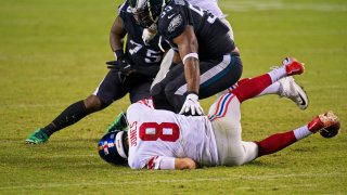 Giants quarterback Daniel Jones on ground after being sacked