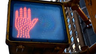 Crosswalk sign showing don't walk signal