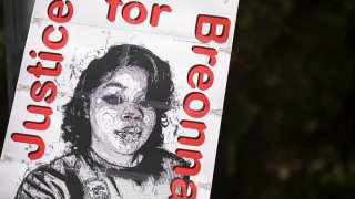 A demonstrator holds a sign demanding justice for Breonna Taylor, Sept. 19, 2020, in Austin, Texas.