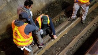 Man stuck on tracks helped by LIRR workers