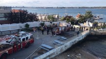 emergency crews respond to crash of a small aircraft at Queens pier