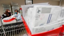 Lehigh County workers count ballots as vote counting in the general election continues, Thursday, Nov. 5, 2020, in Allentown, Pennsylvania. Joe Biden took the lead in Pennsylvania early Friday morning.