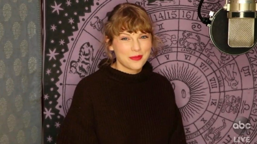 Taylor Swift accepts the award for artist of the year at the American Music Awards at the Microsoft Theater in Los Angeles on Nov. 22, 2020.