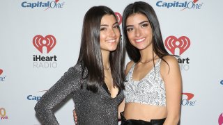 In this Dec. 13, 2019, file photo, Charli D'Amelio (L) and Dixie D'Amelio arrive at iHeartRadio's Z100 Jingle Ball 2019 at Madison Square Garden in New York City.