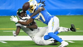 Tevaughn Campbell #37 of the Los Angeles Chargers breaks up a catch to Denzel Mims #11 of the New York Jets