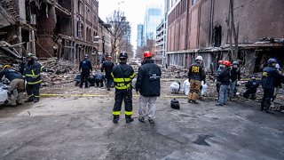 In this Dec. 28, 2020, photo provided by the FBI and Bureau of Alcohol, Tobacco, Firearms and Explosives, FBI and ATF Evidence Response Teams process the scene of the Christmas Day blast in Nashville, Tennessee.