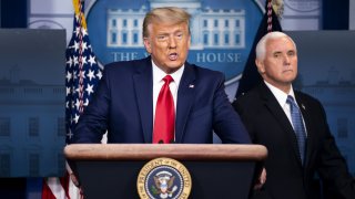 U.S. President Donald Trump speaks during a news conference with Vice President Mike Pence, right, in the James S. Brady Press Briefing Room at the White House in Washington, D.C., U.S., on Tuesday, Nov. 24, 2020. Pennsylvania and Nevada certified Democrat Joe Bidens election victory in their states, dealing the latest blows to President Trump's efforts to overturn the election results.