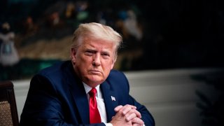 In this Nov. 26, 2020, file photo, President Donald Trump listens during a videoconference with members of military in the Diplomatic Room of the White House in Washington, D.C.