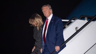 US President Donald Trump and First Lady Melania Trump disembark from Air Force One upon arrival at Palm Beach International Airport in West Palm Beach, Florida, December 23, 2020, as he travels to Mar-a-lago for Christmas and New Year's.