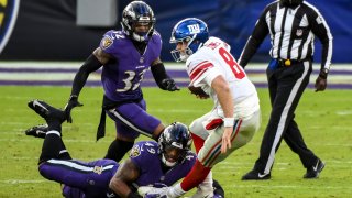 Daniel Jones being tackled by defender