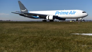 A wide body aircraft emblazoned with Amazon’s Prime logo lands at Lehigh Valley International Airport in Allentown, Pennsylvania, U.S. December 20, 2016. Picture taken December 20, 2016. To match Insight AMAZON.COM-SHIPPING/ REUTERS/Mark Makela
