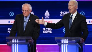 Democratic presidential hopefuls Vermont Senator Bernie Sanders (L) and Former Vice President Joe Biden (R) participate in the tenth Democratic primary debate of the 2020 presidential campaign season co-hosted by CBS News and the Congressional Black Caucus Institute at the Gaillard Center in Charleston, South Carolina, on February 25, 2020.