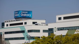 An advertisement for Samsung Electronics Co. Galaxy smartphones is displayed atop a building in the company’s mobile business factory in Gumi, South Korea, on Sunday, April 5, 2020.