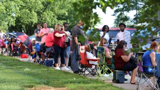 Hundreds of unemployed Kentucky residents wait in long lines for help with their unemployment claims on June 19, 2020.