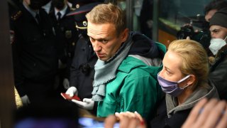 In this Jan. 17, 2021, file photo, Russian opposition leader Alexei Navalny and his wife Yulia are seen at the passport control point at Moscow's Sheremetyevo airport.