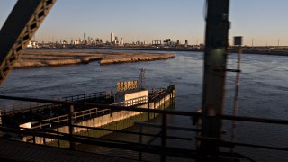 The Manhattan skyline stands past the Portal Bridge above the Hackensack River on Amtrak’s northeast corridor line near Newark, New Jersey, U.S., on Friday, Jan. 11, 2019.