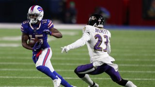 John Brown #15 of the Buffalo Bills runs with the ball after a catch in the fourth quarter against Anthony Averett #23 of the Baltimore Ravens