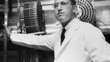 Dr. Jonas Salk stands in the University of Pittsburgh laboratory in which he developed a vaccine for polio.