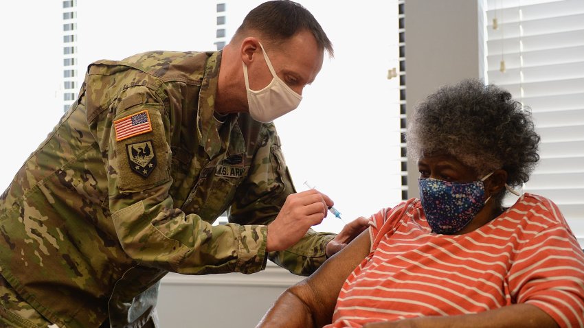 In this Feb. 11, 2021, file photo, Staff Sergeant Herbert Lins of the Missouri Army National Guard administers the COVID-19 vaccine to a resident during a vaccination event at the Jeff Vander Lou Senior living facility in St Louis, Missouri.