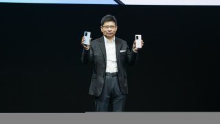 Richard Yu, CEO of Huawei’s consumer business group, holds the company’s new Mate X2 foldable smartphone during a virtual launch on February 22, 2021.