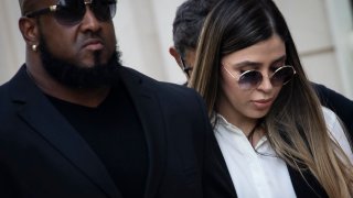 Emma Coronel Aispuro, wife of Joaquin “El Chapo” Guzman, is escorted by security as she leaves federal court, July 17, 2019 in the Brooklyn borough of New York City.