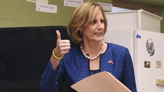 Republican Congresswoman Claudia Tenney signals she successfully cast her ballot after voting at St. George's Church