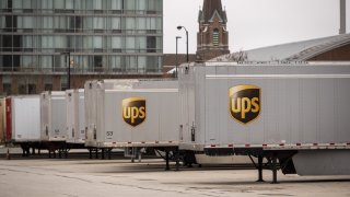 A United Parcel Service Inc. (UPS) trucks outside a distribution center in Chicago