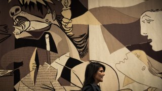 Nikka Haley stands in front of Guernica tapestry