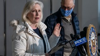 Senator Kirsten Gillibrand speaks at joint press conference with Senator Chuck Schumer in the lobby of 875 3rd Avenue of Manhattan.