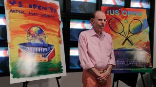 In this June 14, 2017, file photo, artist Peter Max poses for photos during the unveiling of the theme art he created for the 2017 U.S. Open tennis tournament in New York. Max also created the theme art first featuring Arthur Ashe Stadium when it was brand new 20 years ago.