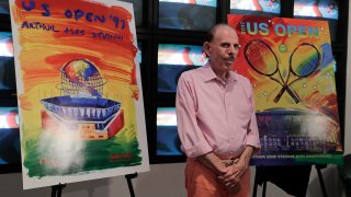 In this June 14, 2017, file photo, artist Peter Max poses for photos during the unveiling of the theme art he created for the 2017 U.S. Open tennis tournament in New York. Max also created the theme art first featuring Arthur Ashe Stadium when it was brand new 20 years ago.
