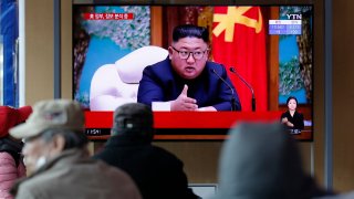 People watch a TV screen showing a news program reporting about North Korean leader Kim Jong Un with a file image at the Seoul Railway Station in Seoul, South Korea, Tuesday, April 21, 2020. The South Korean government is looking into unconfirmed reports saying North Korean leader Kim is in fragile condition after surgery.