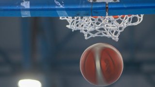 File image of a basketball dropping in the air.