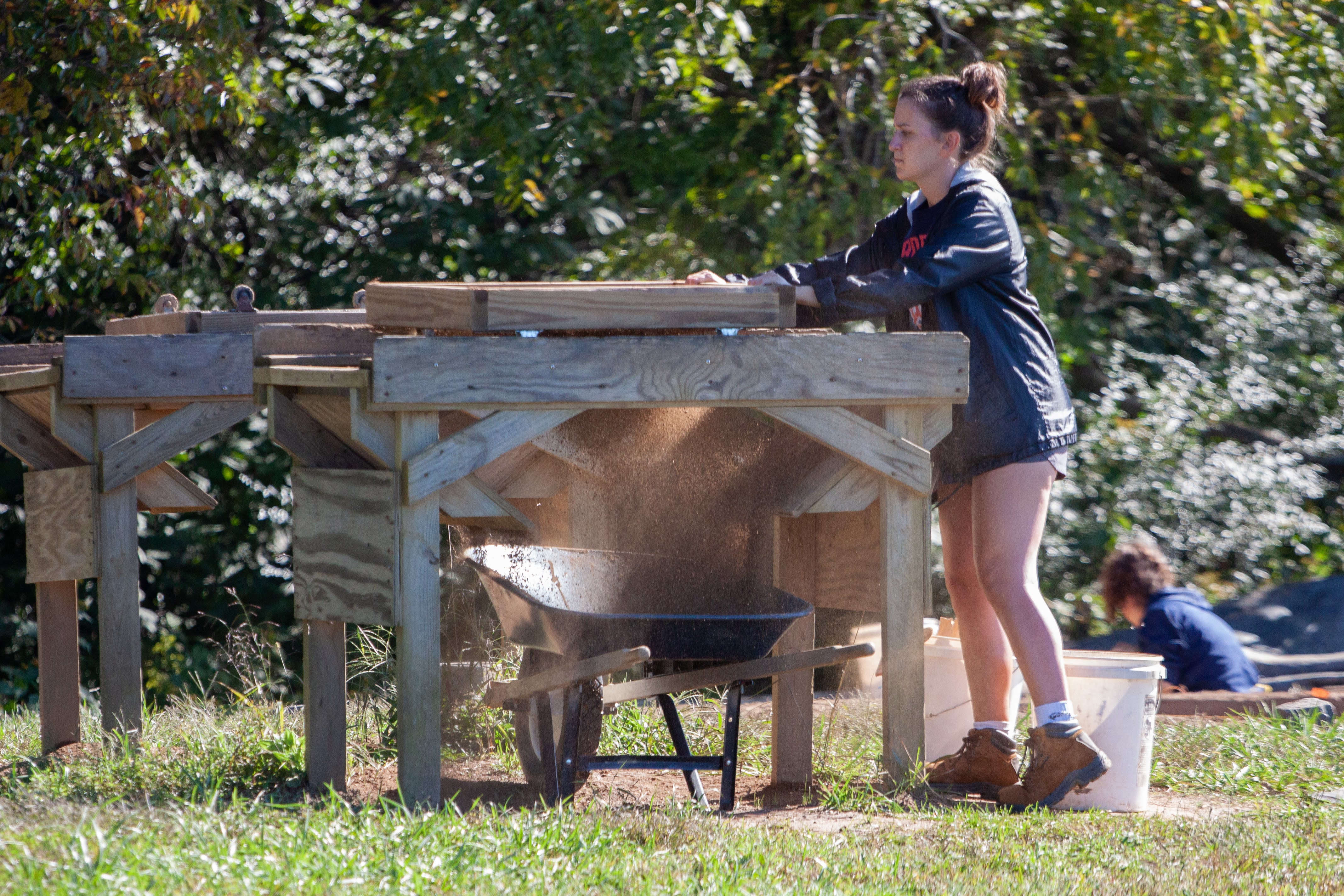 A member of the Historic St. Mary’s City archaeological team sifts through soil recently unearthed.