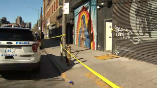 A Williamsburg garage converted into a makeshift event space was cordoned off by police tape following an overnight shooting that left five people injured, police said