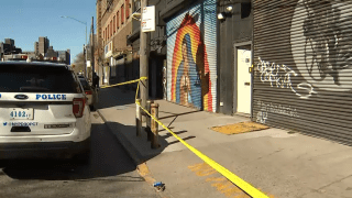 A Williamsburg garage converted into a makeshift event space was cordoned off by police tape following an overnight shooting that left five people injured, police said