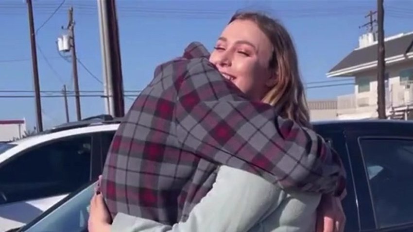 Jennifer Arellano hugs her father, Corey Davis, as the two met for the first time on Saturday, March 6, 2021.