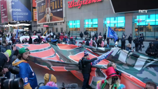 Supporters of Donald Trump carry a 50-foot flag through Manhattan that reads "Trump 2024."