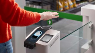 Amazon One connects a shopper’s palm to their credit card, letting them pay without waiting in line.